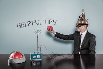 Helpful tips concept with businessman holding brain