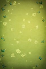 Grungy green spring background with white transparent flowers, blue butterflies and dark vignette.