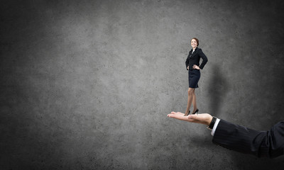 Palm supporting businesswoman