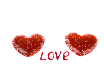 Two red hearts on a white background and the words 