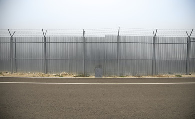 Construction fence along road