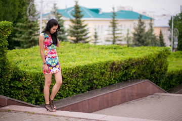 Naklejka premium Beautiful young woman in color dress