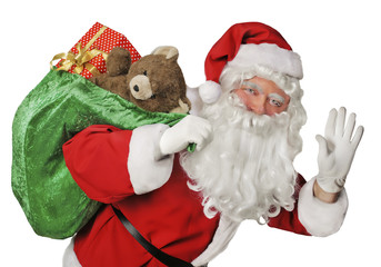 Santa Claus and the gifts bag/ Isolated over white