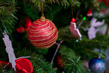 Closeup of ball on a decorated Christmas tree