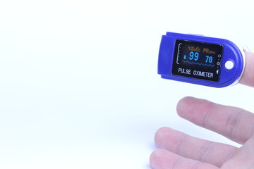 A pulse oximeter on the finger 