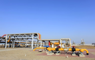 Oil field scene, oil pipelines and facilities