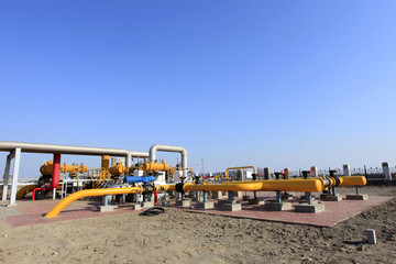 Oil field scene, oil pipelines and facilities