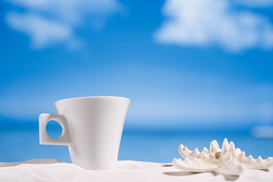 coffee cup on beach