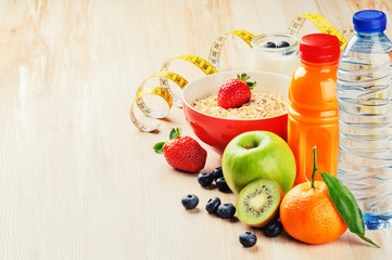 Healthy food and fitness concept. Fresh fruits, juice and cereal