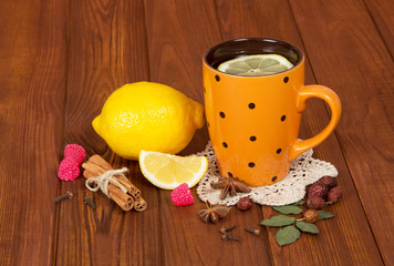 Cup of tea with lemon and spices