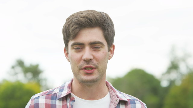  Happy young man having a video chat, as seen from the computer screen's pov
