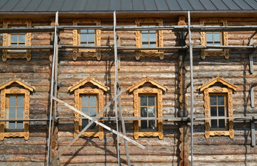 The construction woods on a wall of the wooden building. Sacred