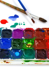 Fototapeta premium Watercolor paints and brushes isolated on a white background