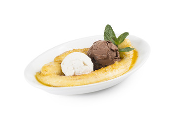 Two scoops of ice cream, cream and chocolate with a banana fried in sugar syrup