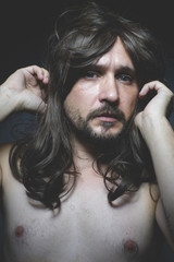 guy sexy naked man with long dark hair, intense eyes and blue ey