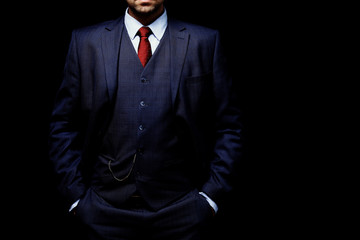 man in suit on black background