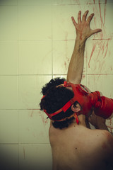 retro naked man with red gas mask, blood, despair and suicide