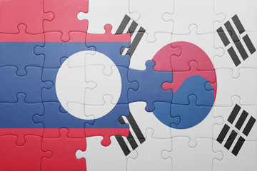 puzzle with the national flag of laos and south korea