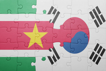 puzzle with the national flag of suriname and south korea