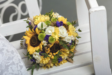 wedding rings and roses bouquet