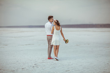 Fototapeta premium Couple walking on beach. Wedding