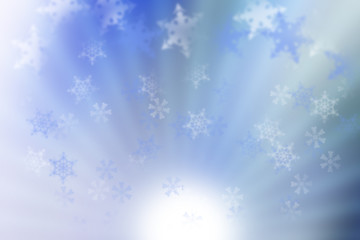 Fototapeta na wymiar Christmas background with beautiful falling snowflakes on light blue background
