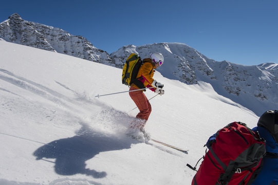 winter sport action - powder skiing in the alps