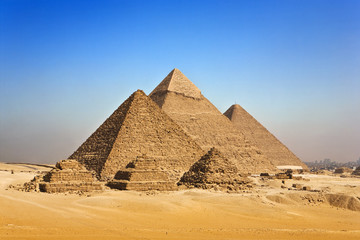 Egypt. Cairo - Giza. General view of pyramids from the Giza Plateau (on front side: 3 pyramids known as Queens' Pyramids; next in order from left: the Pyramid of Menkaure, Khafre and Chufu)