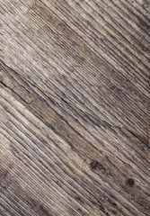 vertical texture of old rotten wood closeup