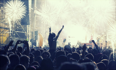 New Year concept - cheering crowd and fireworks