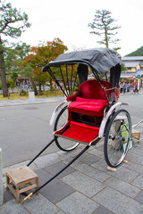 Pulled rickshaw with tree in Arashiyama