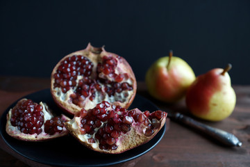 Fruits on a wooden board on a black background