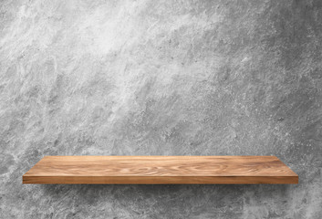 Wooden shelf on concrete wall
