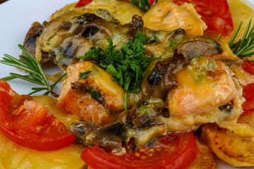 Roasted salmon with potato and tomato