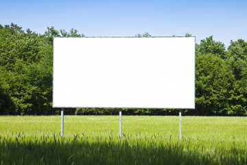 A blank advertising billboard immersed in a wheat field