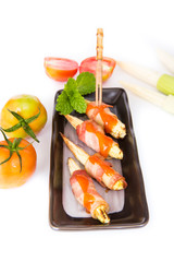 grilled meat with corn on black plate on white background