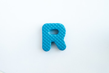 Colored foam is cut into the character .