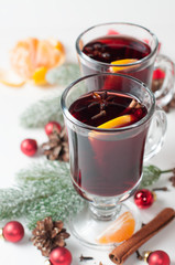 Two glasses of mulled wine on white