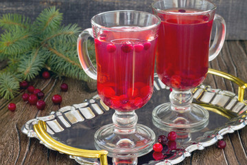 Red cranberry fruit drink two glasses on a tray.