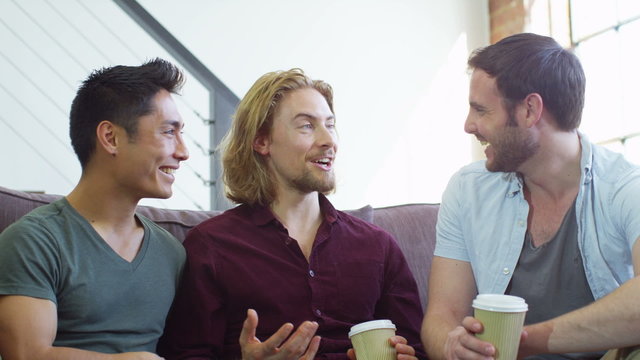 Portrait of young people socialising together and having fun over a coffee