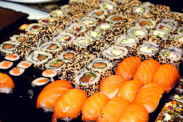 stylish luxury decorated tables with sushi rolls for birthday ce