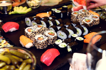 stylish luxury decorated tables with sushi rolls for birthday ce