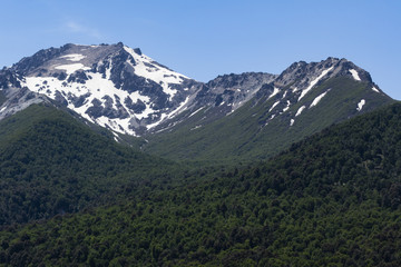 snow peaks, trees on slope
