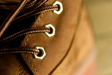 stylish yellow nubuck mens boots on black background, advertisin