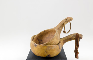 Two hand made wooden cups isolated on white from the North of Sweden.  