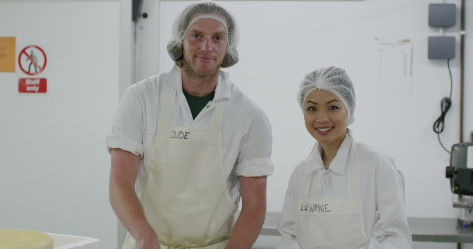 Portrait of cheerful worker in a seafood processing factory