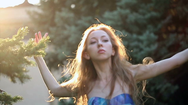 Young graceful ballerina dancing in the city park. Video closeup. The concept of modern dance. Performance. Improvisation.