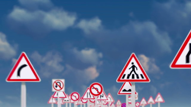 road signs against a blue sky