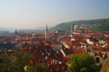 Fototapeta na wymiar View of the old town of Prague - the red roofs and spiers of temples