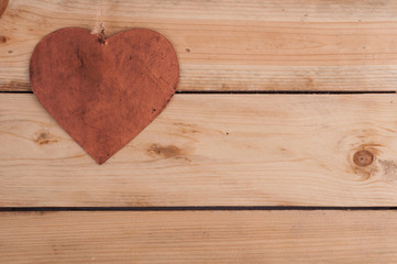 Metal heart on the wooden table